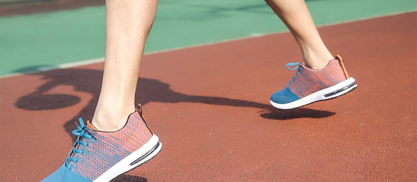 closeup of feet in sneakers on basketball court