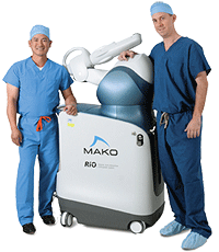 two doctors with the Makoplasty machine