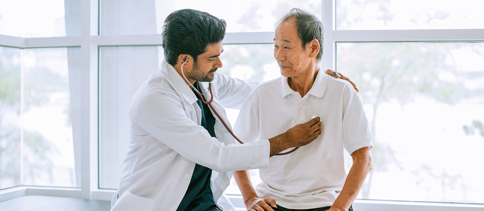 doctor examines patient