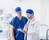 two doctors talking in operating room